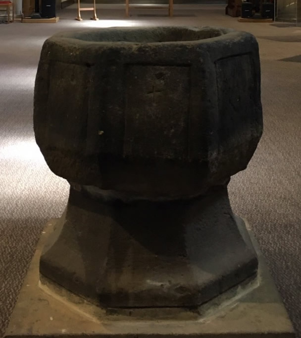 Three crosses and an empty stone tomb
