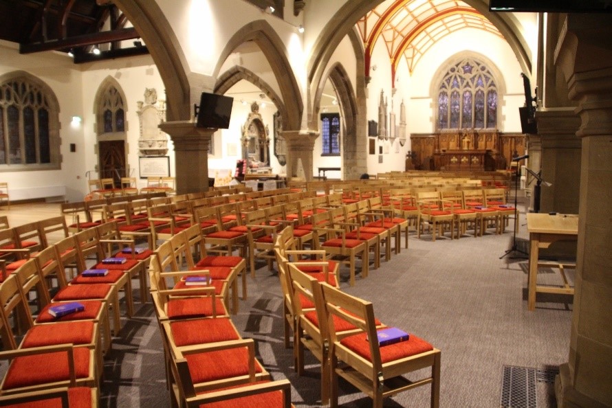 Interior of church after reordering with chairs and bright space