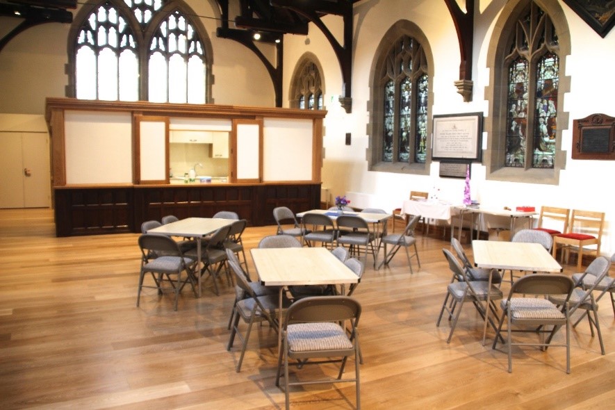 Refreshment area in side reordered church with kitchen, table ann chairs