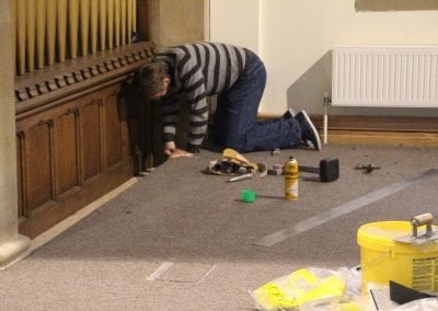 Church floor being carpeted